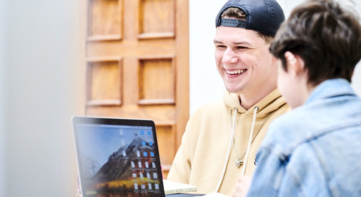 Students laughing while working